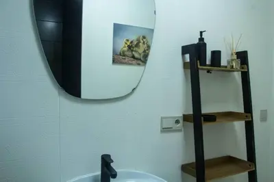 a bathroom with a sink and a mirror at 'T ONDERDAK in Lommel