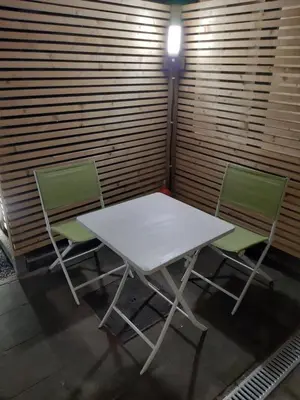 two chairs and a white table and two chairs at 'T ONDERDAK in Lommel