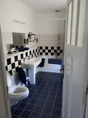 a bathroom with a toilet and a sink at Kanne&kruike in Riemst