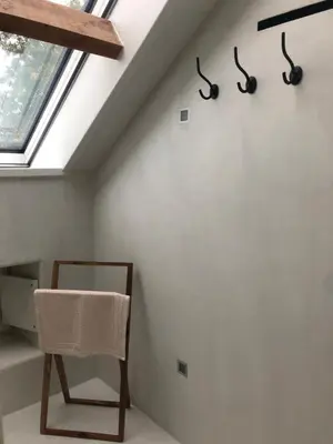 a room with a chair and a skylight at Factorij10 in Peer