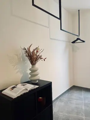 a black table with a vase on top of it at Your Room with A View Bolderberg in Heusden - Zolder