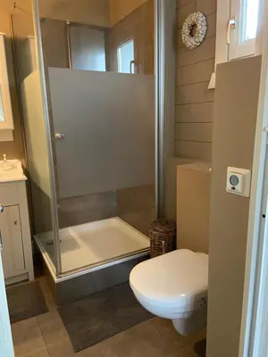 a bathroom with a shower and a toilet at Chalet Eau Vive Meinekom in Maaseik