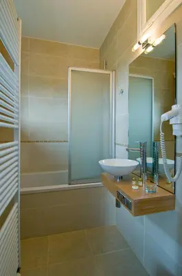 a bathroom with a sink and a shower at De Zilveren Helm in Halen