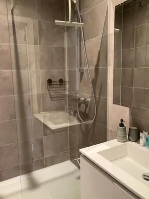 a bathroom with a shower and a sink at Sweet Valley Julia in Zutendaal