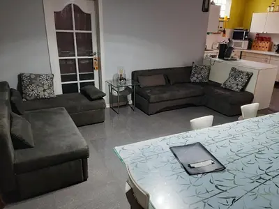 a living room with a couch and a table with a laptop on it at Superb vacancy at Patricks house in Ketzingen