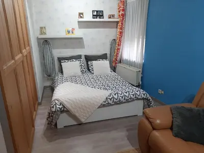 a small bedroom with a bed and a couch at Superb vacancy at Patricks house in Ketzingen
