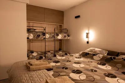 a bedroom with a large bed with plates on it at Vakantiewoning Xalot in Tongeren
