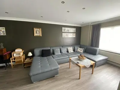 a living room with a couch and a table at 8P 3B Cosy vacation home for 8 persons in Heers