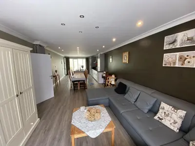 a living room with a couch and a table at 8P 3B Cosy vacation home for 8 persons in Heers