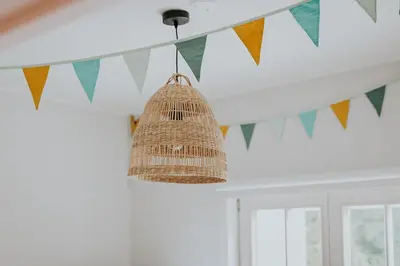 a string of flags hanging from a ceiling at Kipdorp39 in Bree