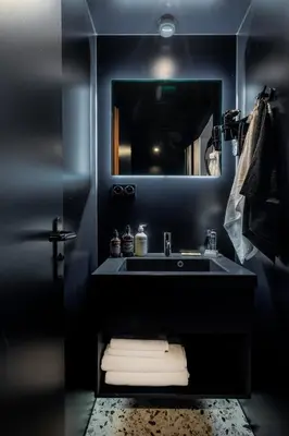 a bathroom with a sink and a mirror at YUST Liege in Liège