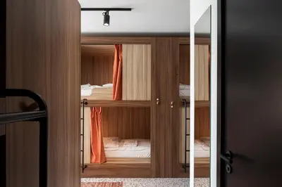 a room with two bunk beds and a door at YUST Liege in Liège