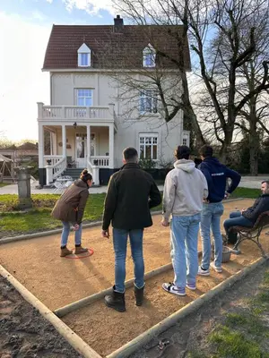 a group of people standing in front of a house at Villa les Bruyères in Dilsen-Stokkem