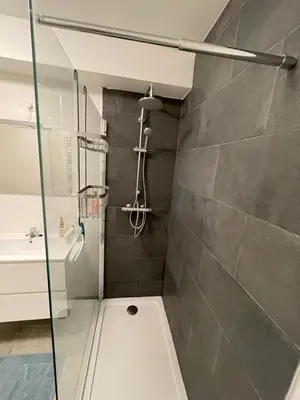 a bathroom with a shower and a sink at Appartement avec extérieur à proximité de Liège in Herstal