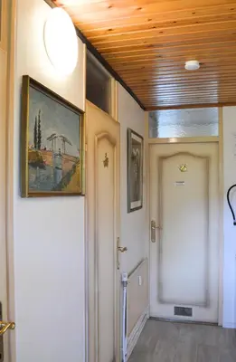 a hallway with a door and a painting on the ceiling at Oasis Verte in La Calamine