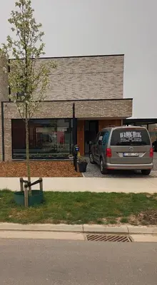 a van parked in a parking lot in front of a building at VERADEMING in Bilzen