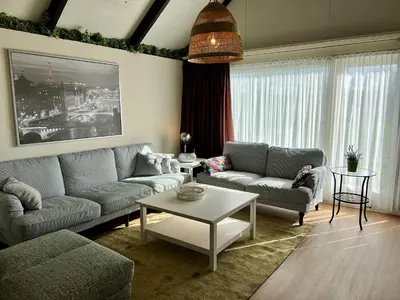 a living room with two couches and a table at Vakantiewoning P3F in Plombières