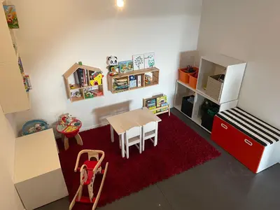 a small room with a table and a refrigerator at Guest House en famille ou en couple à la campagne in Romsée