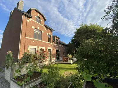 an exterior view of a brick building at Ô Macra House - Aubel, Pays de Herve in Aubel