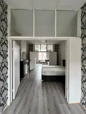 a bedroom with a bed in a room at Proche de tout lieux touristiques à Liège in Liège