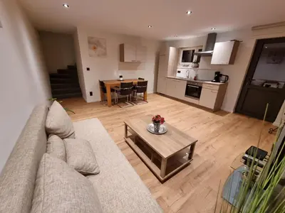 a living room with a couch and a table at Susberg 4 in Pelt