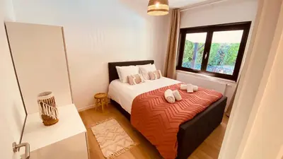 a bedroom with a bed with two towels on it at La douce Rive in Esneux