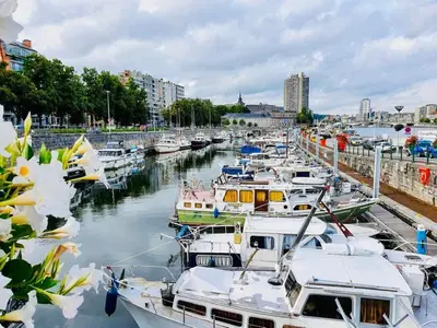 a group of boats docked in a harbor at SuiteDreams - Relax Suite Liège in Liège