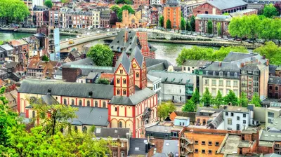 an aerial view of a city with a river and buildings at SuiteDreams - Relax Suite Liège in Liège