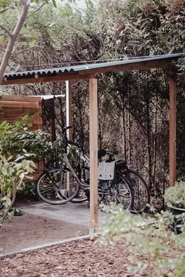 a couple of bikes parked under a gazebo at Mimi's natuurhuisje in Lanaken
