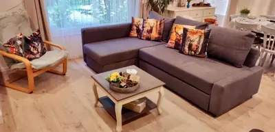 a living room with a couch and a table at Isidaura in Zutendaal