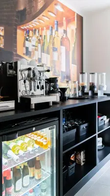 a refrigerator filled with lots of bottles of wine at B&B Koor91 in Hasselt
