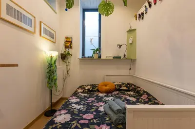 a room with a bed with a pumpkin on it at La Chambre Suspendue by Maison Brasseurs d'Etoiles - Appartement 2 personnes in Liège