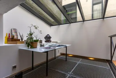 a room with a table and a window at Le Loft Nautilus by Maison Brasseurs d'Etoiles in Liège