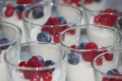 a group of glass cups filled with yogurt and berries at Villa Vigor in Peer