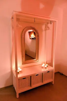 a dressing table with a mirror on a wall at SuiteDreams - Sky Suite - Liège in Liège