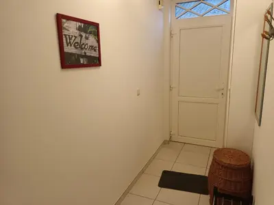 a room with a door and a picture on the wall at Kanaalzicht21 in Hasselt