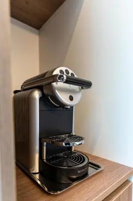a coffee maker sitting on top of a coffee machine at B&B Tabibito in Genk