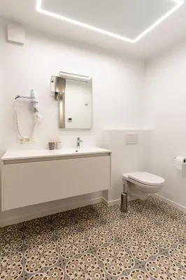 a bathroom with a sink and a toilet at B&B Tabibito in Genk