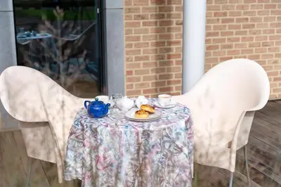 a table with a plate of food on it at B&B Tabibito in Genk