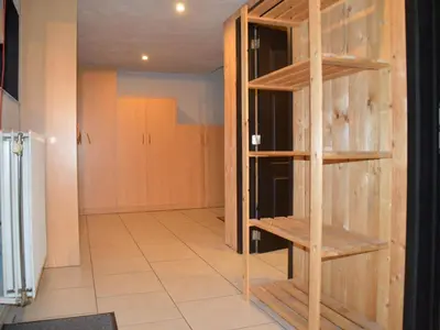 a room with a closet with wooden shelves at Verviers Villa with Sauna in Verviers