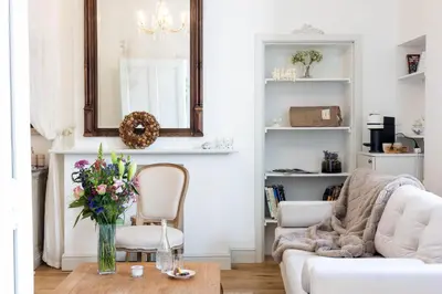 a living room with a vase of flowers on a table at Huis van Loon in Borgloon