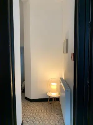 a light sitting on a table in a room at Mr White's in Liège