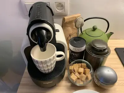 a coffee maker sitting on a counter with a cup at Mr White's in Liège
