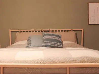 a bed with two pillows on top of it at Retreat near Maasmechelen in Lanaken