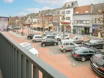 a group of cars parked in a parking lot at Maasmechelen Duplex Retreat in Maasmechelen