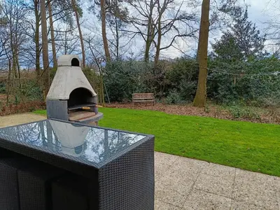 a pizza oven sitting on top of a glass table at Molière in Rekem