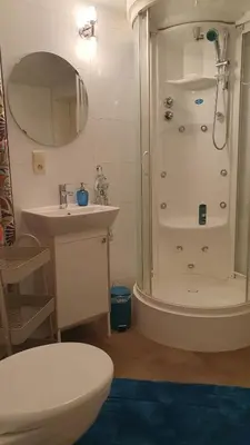 a bathroom with a shower and a toilet and a sink at Studio Klimt Eupen in Eupen