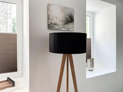 a lamp in a room with a picture on the wall at Hof Gemehret in Eupen