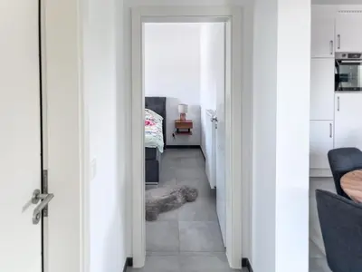 a hallway with a dog laying on the floor at Hof Gemehret in Eupen