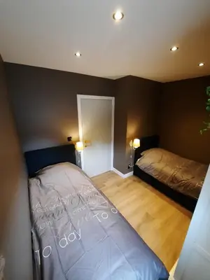 a bedroom with two beds in a room at Guesthouse 66 in Lommel